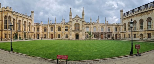 The University of Cambridge panoramic view of a historic college courtyard, featuring a grand,