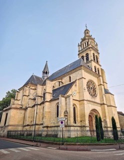 The historic Church Eglise Saint-Martin de L'Isle-Adam in France. Impressive stone architecture,