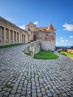 DIEPPE, FRANCE - AUGUST 27, 2023 A cobbled path curves towards the entrance of Dieppe Castle, a