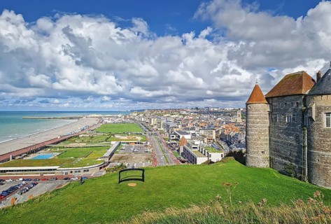 An elevated view captures Dieppe and its coastline. The historic stone castle with pointed towers