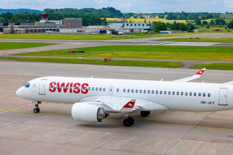 Swiss Airlines Passenger Airplane Taxiing on Runway in a Sunny Summer Day From the Airport in