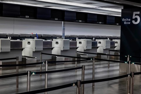 Illuminated and Empty Airport Check in Counter in Zurich Airport at Night in Kloten, Zurich, Zurich