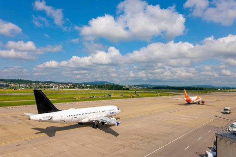 SAS and Easyjet Airlines Passenger Airplane Taxiing and Take Off on Runway in a Sunny Summer Day