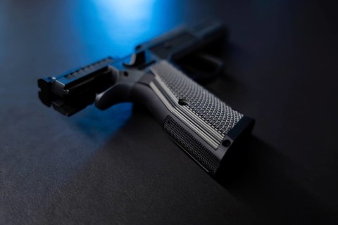 Modern Elegant Sport Handgun For IPDA with Blue Light on Grey Background in Switzerland