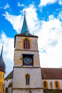 Old Town with House and Clock Tower with Sky and Clouds in a Sunny Autumn Day in City of Biel,