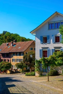 Medieval Old City Street with House in a Sunny Summer Day with Blue Sky in Regensberg, Zurich