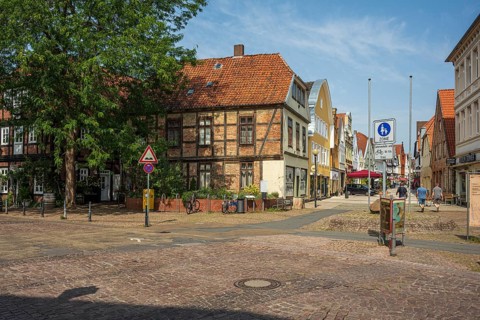 Historic half-timbered houses with red bricks, quiet street neighbourhood with bicycles, Verden an
