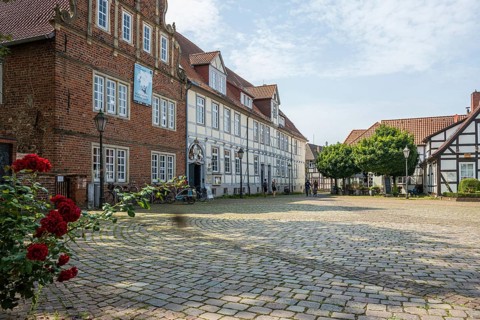 Historic half-timbered houses with cobbled square and roses. Quiet and peaceful atmosphere, Verden