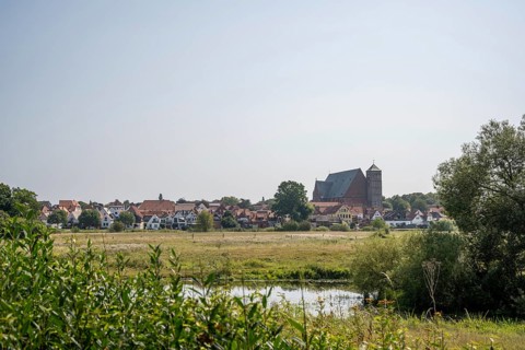 Rural village with church, surrounded by meadows. Quiet, peaceful countryside, cathedral, Verden an