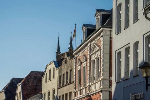 Row of historic buildings with ornate facades under a clear sky, Warendorf, Münsterland, North