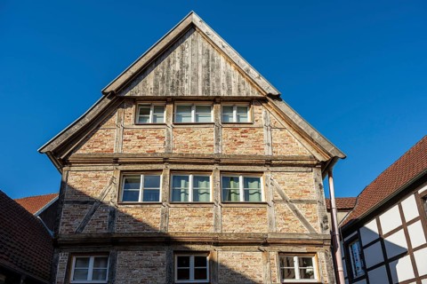 Large half-timbered house under a blue sky, representing traditional architecture, Warendorf,