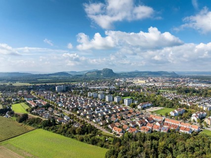 Aerial view of the town of Singen am Hohentwiel, on the horizon the Hegau Mountains, district of
