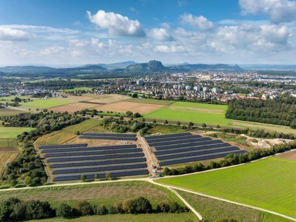 Aerial view, solar modules, solar park, photovoltaics, power generation from solar energy, behind