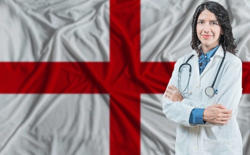 English medicine and healthcare concept. Doctor close up against England flag background