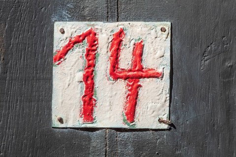 House number sign number fourteen on a half-timbered house in the old town centre, Hameln, Lower