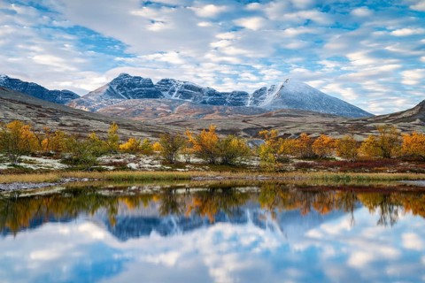 Autumn landscape in Rondane National Park, mountains Høgronden, Midtronden and Digerronden Dørålen,