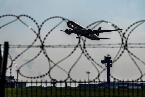 Symbolic image security at the airport, outer fence at Düsseldorf International Airport, steel wire