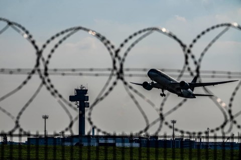 Symbolic image security at the airport, outer fence at Düsseldorf International Airport, steel wire