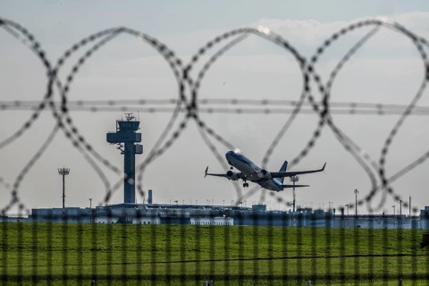 Symbolic image security at the airport, outer fence at Düsseldorf International Airport, steel wire