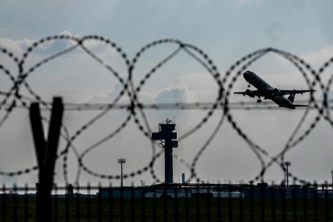 Symbolic image security at the airport, outer fence at Düsseldorf International Airport, steel wire
