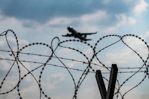 Symbolic image security at the airport, outer fence at Düsseldorf International Airport, steel wire