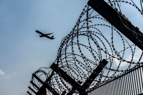 Symbolic image security at the airport, outer fence at Düsseldorf International Airport, steel wire