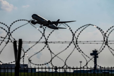 Symbolic image security at the airport, outer fence at Düsseldorf International Airport, steel wire