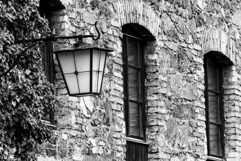 Old stone façade, historic lantern, Mühletorplatz, Feldkirch, Vorarlberg, Austria