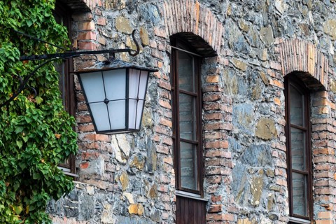 Old stone façade, historic lantern, Mühletorplatz, Feldkirch, Vorarlberg, Austria