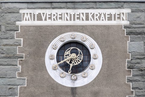 Facade with wall clock, historic building, district court, Feldkirch, Vorarlberg, Austria