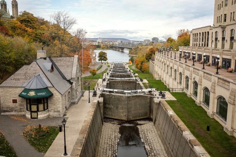 Scenic view of the Rideau Canal locks, leading to the Ottawa River surrounded by autumn trees and