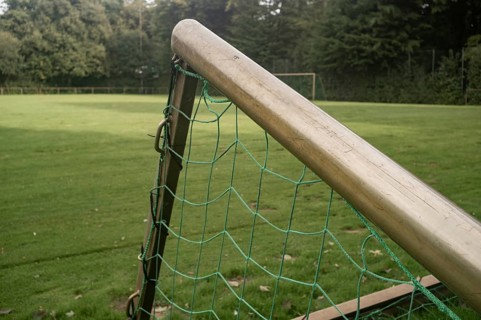 Borken, NRW, Germany, Soccer goal with green net on a grass sports field