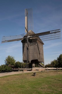 Borken, NRW, Germany, Historic wooden windmill featuring large sails, standing in a green field