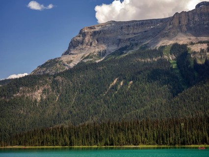 Tranquil Emerald Lake with clear blue water and forested mountains of the Canadian Rocky Mountains
