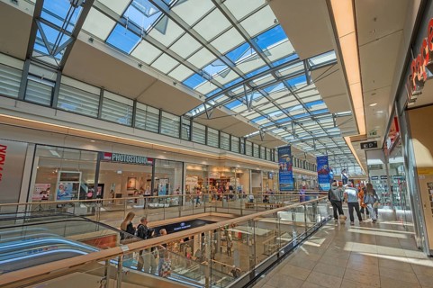 Shops, escalator and skylight in Forum Allgäu, Kempten, Allgäu, Swabia, Germany