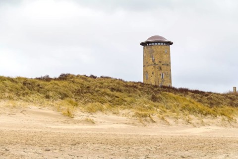 Coastal beach scenery at the North Sea including the water tower near Domburg in Walcheren in the