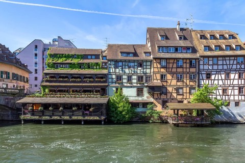 Idyllic waterside impression around a district named Petite France in Strasbourg, a city at the