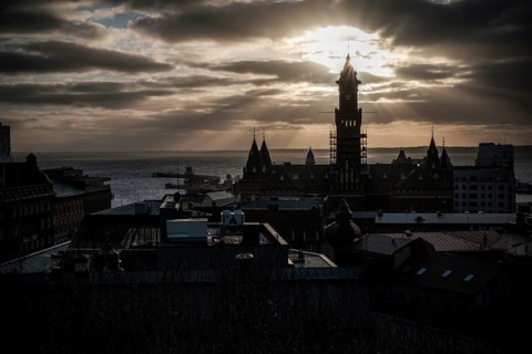 A silhouetted tower during sunset with a dramatic cloudscape and looking out to the Oresund Strait,