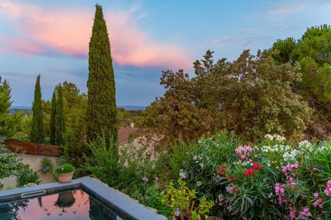 Idyllic scenery including a small swimming pool seen in Beaumes-de-Venise, a commune in the