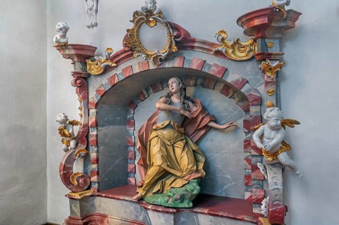 Church of St Gallus and Ulrich, niche with female figure of a saint and putti, Kisslegg, Allgäu,