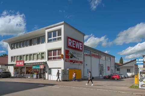 Blue sky. white clouds, REWE store in Haubenschloßstraße, Kempten, Allgäu, Swabia, Germany