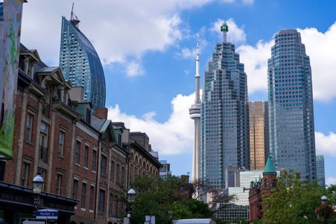 Toronto's skyline with the CN Tower and historic buildings on a sunny day in Toronto, Ontario,