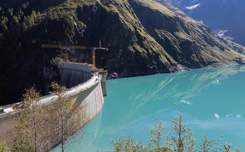 Waterfall bottom reservoir, dam wall, construction site, mountain panorama, energy industry, hiking