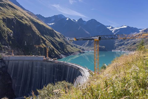 Waterfall bottom reservoir, dam wall, construction site, mountain panorama, energy industry, hiking