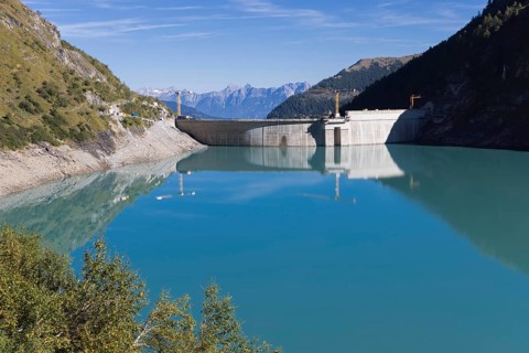 Waterfall bottom reservoir, dam wall, construction site, mountain panorama, energy industry, hiking
