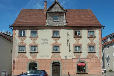Facade with painting and nose sign, house of a bakery in Kisslegg, Allgäu, Baden-Württemberg,