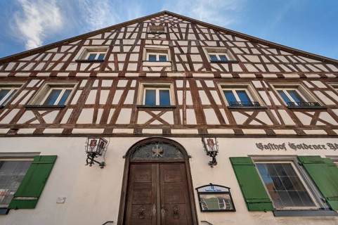 Pointed gable façade with half-timbering, Gasthof Goldener Adler in Kisslegg, Allgäu,