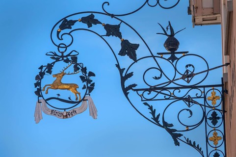 Nose sign with golden stag of the Deer-Post restaurant in Kisslegg, Allgäu, Baden-Württemberg,