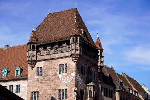 Historic building with oriels and decorations under a blue sky, Nuremberg, Middle Franconia,