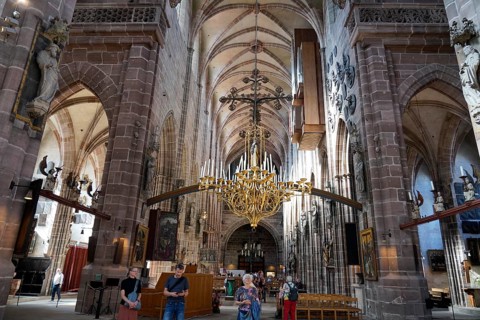 Spacious church interior with high vaults and magnificent chandelier, St. Lawrence Church,
